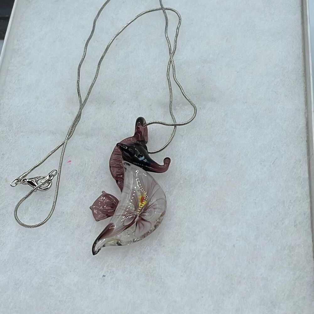 Handblown art glass seahorse pendant on silvertone 18” chain.